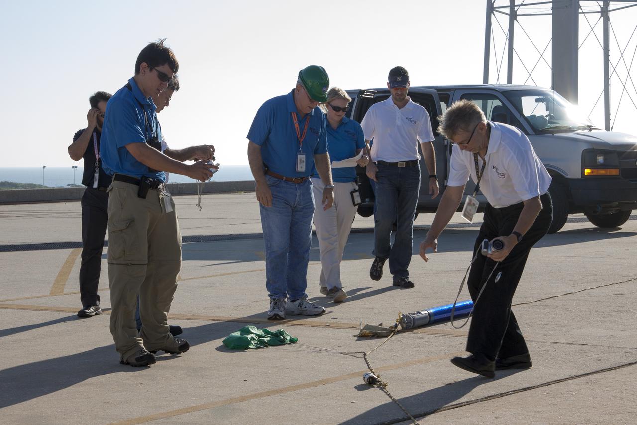 CAPE CANAVERAL, Fla. -- At NASA's Kennedy Space Center in Florida, engineers recover a small rocket following its launch as part of Rocket University. The goal was to test its systems and to verify that it performed as designed. As part of Rocket University, the engineers are given an opportunity to work a fast-track project to develop skills in developing spacecraft systems of the future. As NASA plans for future spaceflight programs to low-Earth orbit and beyond, teams of engineers at Kennedy are gaining experience in designing and flying launch vehicle systems on a small scale. Four teams of five to eight members from Kennedy are designing rockets complete with avionics and recovery systems. Launch operations require coordination with federal agencies, just as they would with rockets launched in support of a NASA mission. Photo credit: NASA_Jim Grossmann