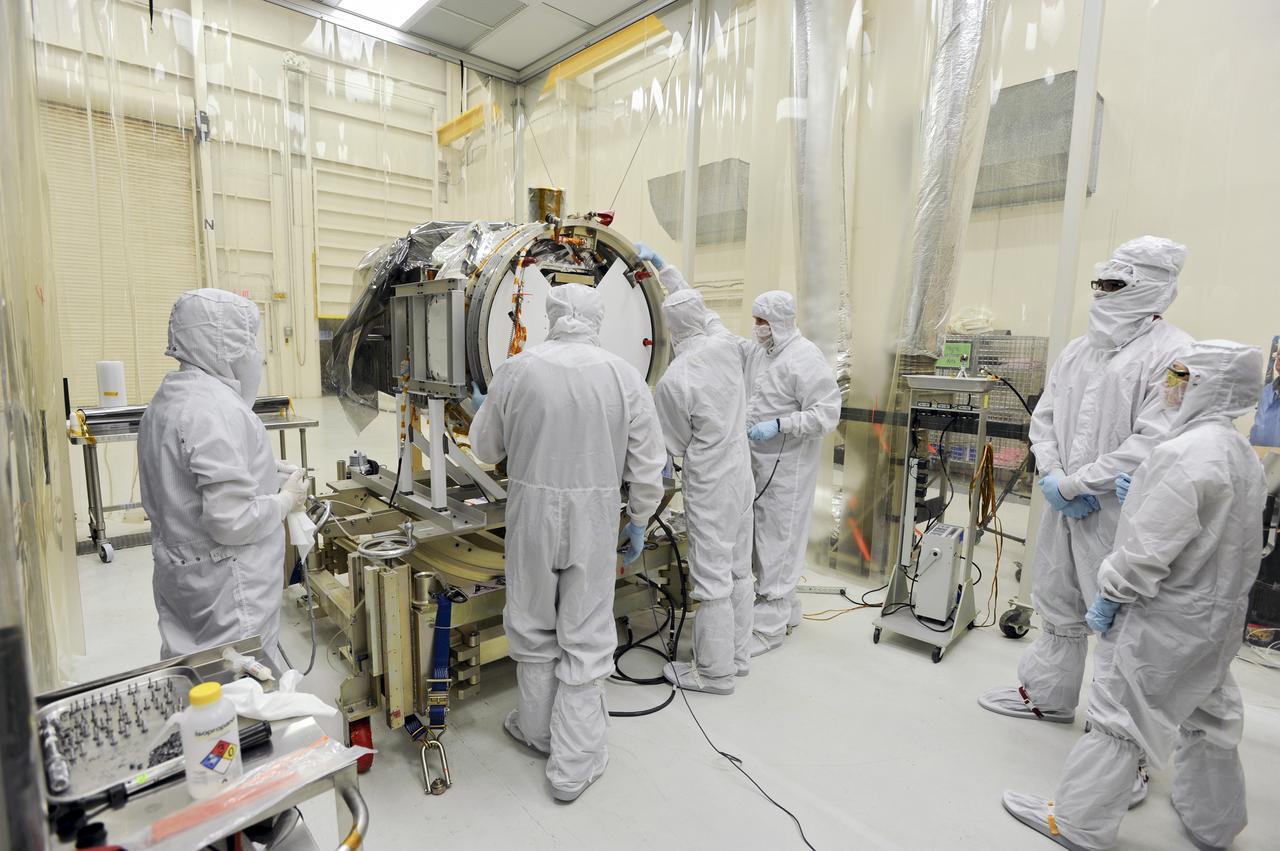 VANDENBERG AFB, Calif. – Members of the IRIS and Pegasus launch teams working in a hangar at Vandenberg work connect the separation ring for NASA's IRIS spacecraft, short for Interface Region Imaging Spectrograph. The separation system will push IRIS away from an Orbital Pegasus XL rocket when the spacecraft reaches its proper orbit after launch. Scheduled for launch from Vandenberg Air Force Base no earlier than June 26, 2013, IRIS will open a new window of discovery by tracing the flow of energy and plasma through the chromospheres and transition region into the sun’s corona using spectrometry and imaging. IRIS fills a crucial gap in our ability to advance studies of the sun-to-Earth connection by tracing the flow of energy and plasma through the foundation of the corona and the region around the sun known as the heliosphere. Photo credit: NASA_Doug Gruben