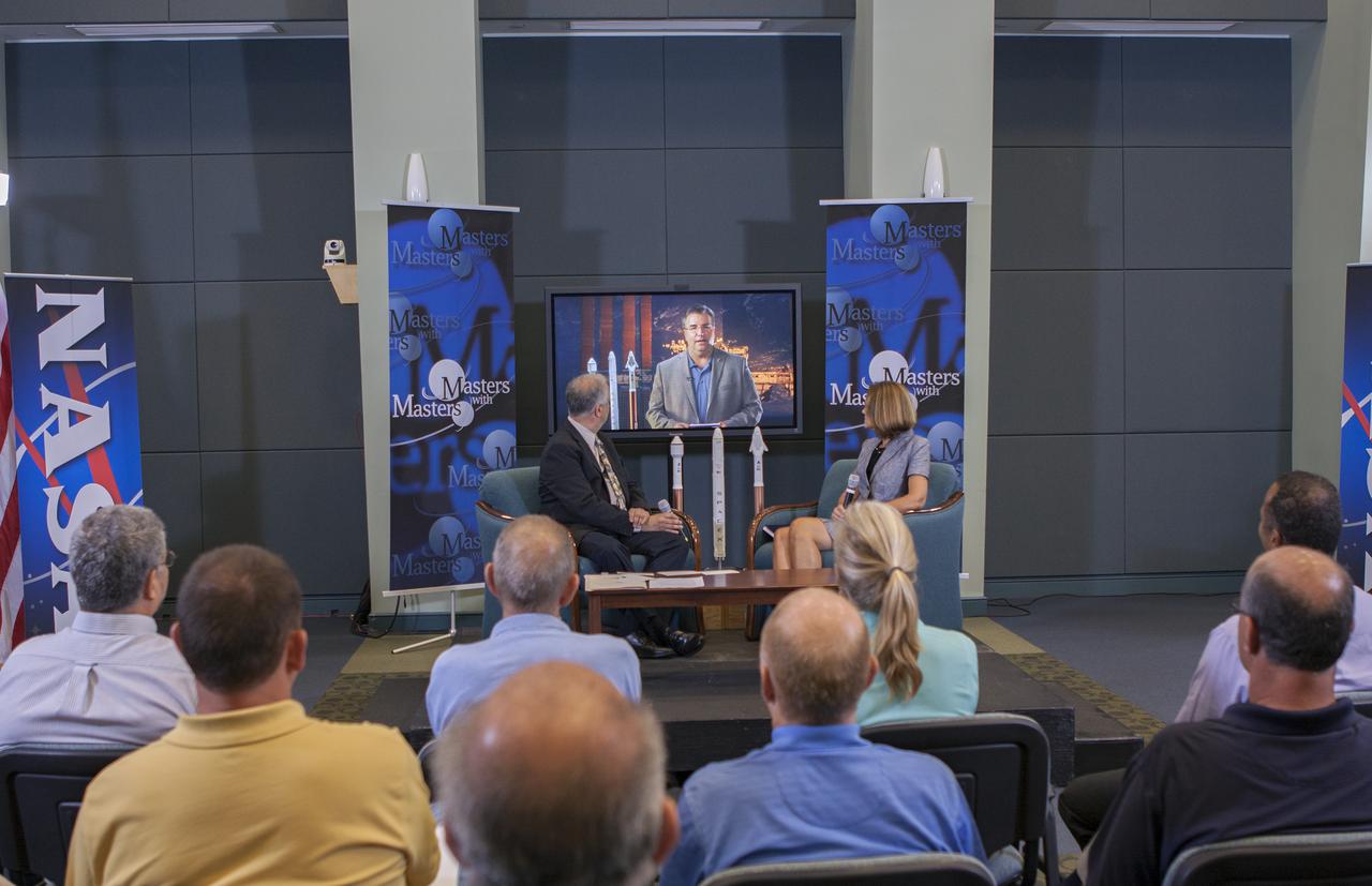 CAPE CANAVERAL, Fla. – Ed Hoffman and Lisa Colloredo discuss NASA's Commercial Crew Program during the first of a weeklong series called 'Masters with Masters' at the agency's Kennedy Space Center in Florida. Hoffman, NASA's chief Knowledge officer, and Colloredo, associate program manager at Kennedy, were joined by phone by Ed Mango, program manager for CCP. Photo credit: NASA_Jim Grossmann
