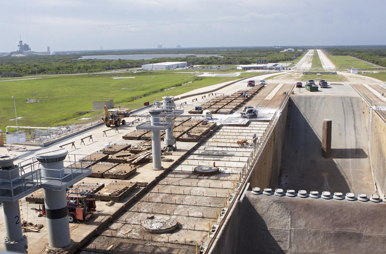CAPE CANAVERAL, Fla. -- At Launch Pad 39B at NASA’s Kennedy Space Center in Florida, nearly all of the crawler track panels on the pad’s surface have been removed. The concrete surface beneath the panels and the catacomb roof below will be inspected for water damage and repaired.   There are 176 panels, each weighing about 30,000 pounds that will be removed. Launch Pad 39B is being refurbished to support NASA’s Space Launch System and other launch vehicles. The Ground Systems Development and Operations, or GSDO, Program office at Kennedy is leading the center’s transformation to safely handle a variety of rockets and spacecraft. For more information about GSDO, visit: http:__go.nasa.gov_groundsystems.  Photo credit: NASA_Jim Grossman