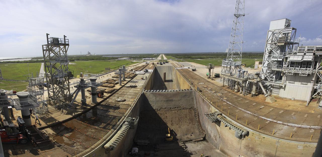 CAPE CANAVERAL, Fla. -- At Launch Pad 39B at NASA’s Kennedy Space Center in Florida, the view from a fisheye lens reveals nearly all of the crawler track panels on the pad’s surface have been removed. The concrete surface beneath the panels and the catacomb roof below will be inspected for water damage and repaired. Work also is underway to remove the flame trench deflector that sits below and between the left and right crawler track panels.     There are 176 panels, each weighing about 30,000 pounds that will be removed. Launch Pad 39B is being refurbished to support NASA’s Space Launch System and other launch vehicles. The Ground Systems Development and Operations, or GSDO, Program office at Kennedy is leading the center’s transformation to safely handle a variety of rockets and spacecraft. For more information about GSDO, visit: http:__go.nasa.gov_groundsystems.  Photo credit: NASA_Jim Grossman