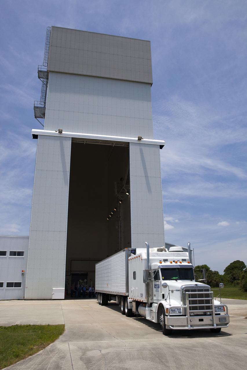 CAPE CANAVERAL, Fla. – At NASA’s Kennedy Space Center in Florida, a truck arrives at the Launch Abort System Facility with the jettison motor from Aerojet in Redmond, Wash. The motor is part of the Launch Abort System, or LAS, for Exploration Flight Test 1, or EFT-1, of the agency’s Orion Multi-Purpose Crew Vehicle. The motor will jettison the LAS away from the Orion crew capsule during the flight test’s early ascent phase. Orion’s Launch Abort System is designed to safely pull the Orion crew module away from the launch vehicle in the event of an emergency on the launch pad or during the initial ascent of NASA’s Space Launch System, or SLS, rocket.  Orion is the exploration spacecraft designed to carry crews to space beyond low Earth orbit. It will provide emergency abort capability, sustain the crew during the space travel and provide safe re-entry from deep space return velocities. Orion’s first unpiloted test flight is scheduled to launch in 2014 atop a Delta IV rocket. A second uncrewed flight test is scheduled for 2017 on the SLS rocket. For more information, visit http:__www.nasa.gov_orion. Photo credit: NASA_Dimitri Gerondidakis