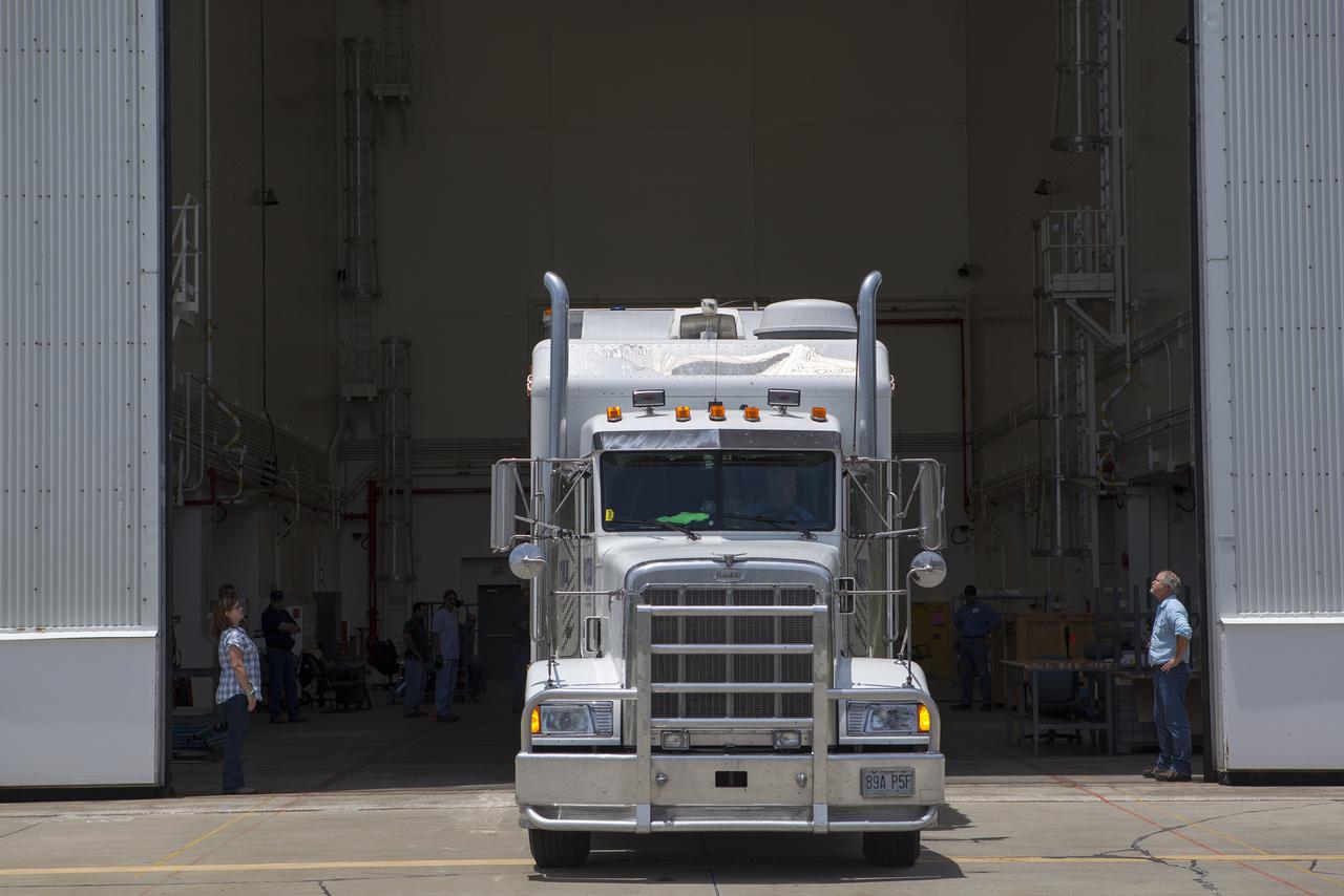 CAPE CANAVERAL, Fla. – At NASA’s Kennedy Space Center in Florida, a truck arrives at the Launch Abort System Facility with the jettison motor from Aerojet in Redmond, Wash. The motor is part of the Launch Abort System, or LAS, for Exploration Flight Test 1, or EFT-1, of the agency’s Orion Multi-Purpose Crew Vehicle. The motor will jettison the LAS away from the Orion crew capsule during the flight test’s early ascent phase. Orion’s Launch Abort System is designed to safely pull the Orion crew module away from the launch vehicle in the event of an emergency on the launch pad or during the initial ascent of NASA’s Space Launch System, or SLS, rocket.  Orion is the exploration spacecraft designed to carry crews to space beyond low Earth orbit. It will provide emergency abort capability, sustain the crew during the space travel and provide safe re-entry from deep space return velocities. Orion’s first unpiloted test flight is scheduled to launch in 2014 atop a Delta IV rocket. A second uncrewed flight test is scheduled for 2017 on the SLS rocket. For more information, visit http:__www.nasa.gov_orion. Photo credit: NASA_Dimitri Gerondidakis