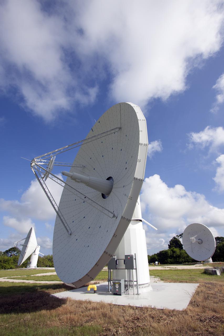 CAPE CANAVERAL, Fla. -- At NASA’s Kennedy Space Center in Florida, one of the three Ka-Band Objects Observation and Monitoring, or Ka-BOOM, testbed antennas is used to track the sun during initial testing of the new system.  The goal of Ka-BOOM is to prove technologies that will allow future systems to characterize near-Earth objects in terms of size, shape, rotation_tumble rate and to determine the trajectory of those objects. Radar studies can determine the trajectory 100,000 times more precisely than can optical methods. While also capable of space communication and radio science experiments, developing radar applications is the primary focus of the arrays. The 40-foot-diameter dish antenna arrays are at the site of the former Vertical Processing Facility, which has been demolished. Photo credit: NASA_Jim Grossmann