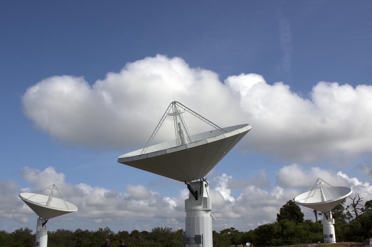 CAPE CANAVERAL, Fla. -- At NASA’s Kennedy Space Center in Florida, the three Ka-Band Objects Observation and Monitoring, or Ka-BOOM, testbed antennas are used to track the pattern of the sun during initial testing of the new system.  The goal of Ka-BOOM is to prove technologies that will allow future systems to characterize near-Earth objects in terms of size, shape, rotation_tumble rate and to determine the trajectory of those objects. Radar studies can determine the trajectory 100,000 times more precisely than can optical methods. While also capable of space communication and radio science experiments, developing radar applications is the primary focus of the arrays. The 40-foot-diameter dish antenna arrays are at the site of the former Vertical Processing Facility, which has been demolished. Photo credit: NASA_Jim Grossmann