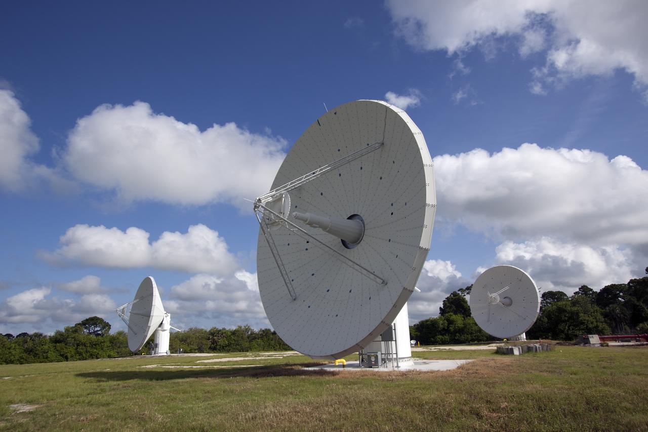 CAPE CANAVERAL, Fla. -- At NASA’s Kennedy Space Center in Florida, one of the three Ka-Band Objects Observation and Monitoring, or Ka-BOOM, testbed antennas is used to track the pattern of the sun during initial testing of the new system.  The goal of Ka-BOOM is to prove technologies that will allow future systems to characterize near-Earth objects in terms of size, shape, rotation_tumble rate and to determine the trajectory of those objects. Radar studies can determine the trajectory 100,000 times more precisely than can optical methods. While also capable of space communication and radio science experiments, developing radar applications is the primary focus of the arrays. The 40-foot-diameter dish antenna arrays are at the site of the former Vertical Processing Facility, which has been demolished. Photo credit: NASA_Jim Grossmann