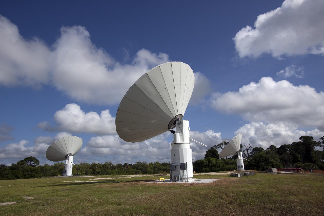 CAPE CANAVERAL, Fla. -- At NASA’s Kennedy Space Center in Florida, the three Ka-Band Objects Observation and Monitoring, or Ka-BOOM, testbed antennas are used to track the pattern of the sun during initial testing of the new system.  The goal of Ka-BOOM is to prove technologies that will allow future systems to characterize near-Earth objects in terms of size, shape, rotation_tumble rate and to determine the trajectory of those objects. Radar studies can determine the trajectory 100,000 times more precisely than can optical methods. While also capable of space communication and radio science experiments, developing radar applications is the primary focus of the arrays. The 40-foot-diameter dish antenna arrays are at the site of the former Vertical Processing Facility, which has been demolished. Photo credit: NASA_Jim Grossmann