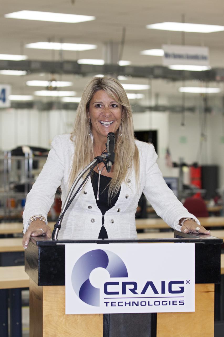 CAPE CANAVERAL, Fla. – At the Aerospace and Defense Manufacturing Center in Cape Canaveral, Fla., Craig Technologies founder and chief executive officer Carol Craig speaks to guests during a community open house at the 161,000-square-foot facility.   In June of last year, NASA signed a partnership agreement with Craig Technologies to maintain an inventory of unique processing and manufacturing equipment for future mission support at the agency's Kennedy Space Center. The Cape Canaveral, Fla., facility, formerly known as the NASA Shuttle Logistics Depot NSLD, is now the Aerospace and Defense Manufacturing Center ADMC. Photo credit: NASA_Kim Shiflett