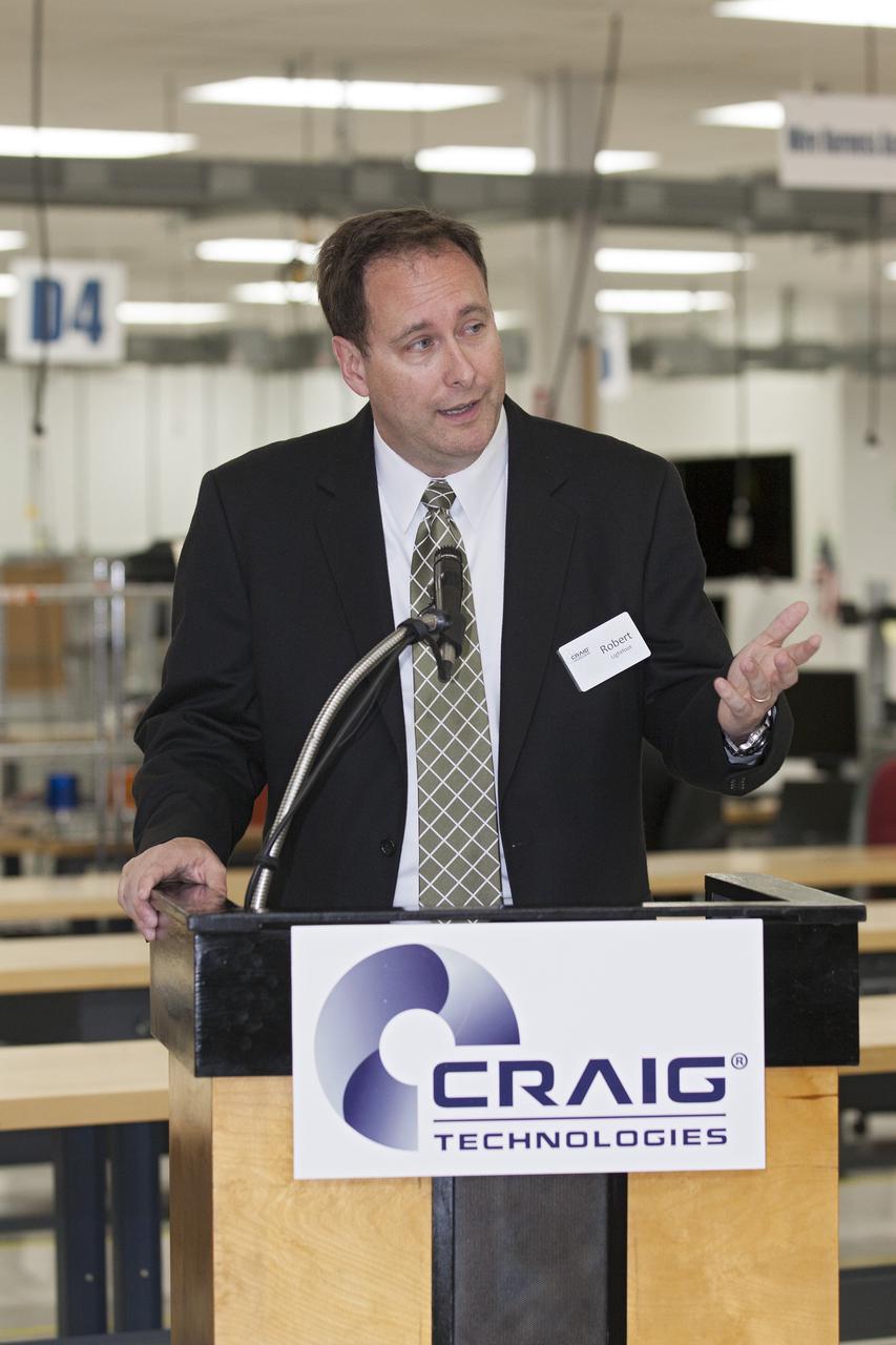CAPE CANAVERAL, Fla. – At the Aerospace and Defense Manufacturing Center in Cape Canaveral, Fla., NASA Associate Administrator Robert Lightfoot speaks to guests during a community open house at the 161,000-square-foot facility now operated by Craig Technologies.   In June of last year, NASA signed a partnership agreement with Craig Technologies to maintain an inventory of unique processing and manufacturing equipment for future mission support at the agency's Kennedy Space Center. The Cape Canaveral, Fla., facility, formerly known as the NASA Shuttle Logistics Depot NSLD, is now the Aerospace and Defense Manufacturing Center ADMC. Photo credit: NASA_Kim Shiflett