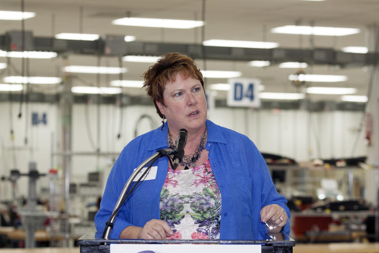 CAPE CANAVERAL, Fla. – At the Aerospace and Defense Manufacturing Center in Cape Canaveral, Fla., Brevard Workforce President Lisa Rice speaks to guests during a community open house at the 161,000-square-foot facility now operated by Craig Technologies.   In June of last year, NASA signed a partnership agreement with Craig Technologies to maintain an inventory of unique processing and manufacturing equipment for future mission support at the agency's Kennedy Space Center. The Cape Canaveral, Fla., facility, formerly known as the NASA Shuttle Logistics Depot NSLD, is now the Aerospace and Defense Manufacturing Center ADMC. Photo credit: NASA_Kim Shiflett