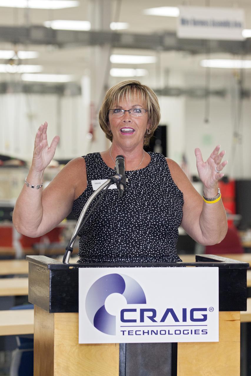 CAPE CANAVERAL, Fla. – At the Aerospace and Defense Manufacturing Center in Cape Canaveral, Fla., Julie Song, regional director of Florida Manufacturing Extension Partnership, speaks to guests during a community open house at the 161,000-square-foot facility now operated by Craig Technologies.   In June of last year, NASA signed a partnership agreement with Craig Technologies to maintain an inventory of unique processing and manufacturing equipment for future mission support at the agency's Kennedy Space Center. The Cape Canaveral, Fla., facility, formerly known as the NASA Shuttle Logistics Depot NSLD, is now the Aerospace and Defense Manufacturing Center ADMC. Photo credit: NASA_Kim Shiflett