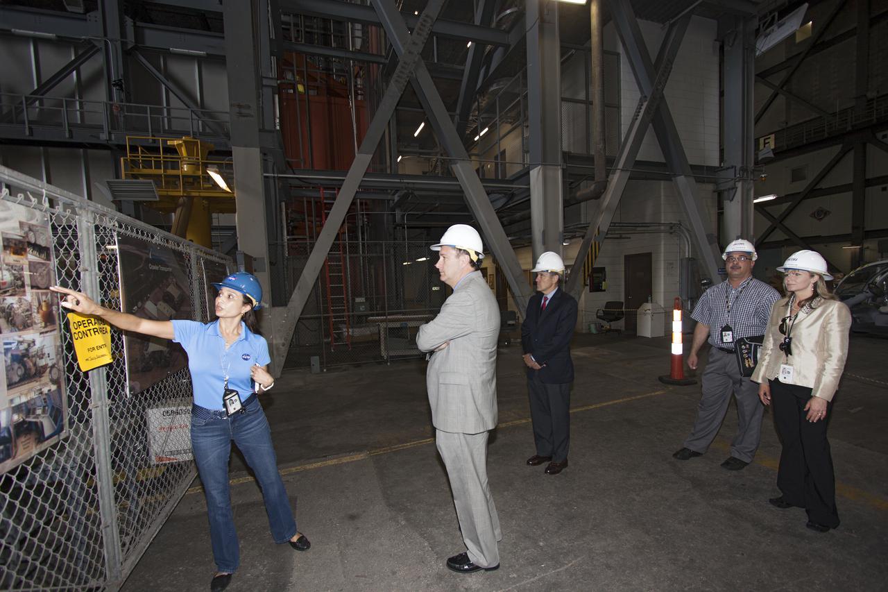 CAPE CANAVERAL, Fla. – NASA Associate Administrator Robert Lightfoot, center, tours the Vehicle Assembly Building, or VAB, during a visit to NASA's Kennedy Space Center in Florida. Here, he receives a briefing from Mary Hanna, crawler-transporter project manager. Behind him, from left, are Kennedy Space Center Director Bob Cabana, Jose Lopez, VAB project manager, and Joy Burkey, program specialist. The VAB is being readied to support NASA's new Orion spacecraft and Space Launch System heavy-lift rocket, the SLS. NASA's FY2014 budget proposal includes a plan to robotically capture a small near-Earth asteroid and redirect it safely to a stable orbit in the Earth-moon system where astronauts can visit and explore it. Performing these elements for the proposed asteroid initiative integrates the best of NASA's science, technology and human exploration capabilities and draws on the innovation of America's brightest scientists and engineers. It uses current and developing capabilities to find both large asteroids that pose a hazard to Earth and small asteroids that could be candidates for the initiative, accelerates our technology development activities in high-powered solar electric propulsion and takes advantage of our hard work on the Space Launch System rocket and Orion spacecraft, helping to keep NASA on target to reach the President's goal of sending humans to Mars in the 2030s. Photo credit: NASA_Jim Grossmann