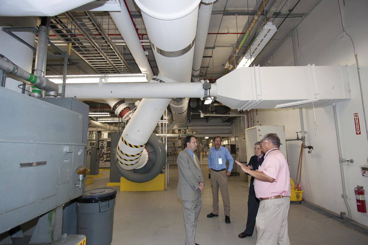 CAPE CANAVERAL, Fla. – NASA Associate Administrator Robert Lightfoot tours the Environmental Control System Room under the surface of Launch Pad 39B during a visit to NASA's Kennedy Space Center in Florida. From left are Lightfoot, Alan Littlefield, Vehicle Integration and Launch chief engineer, Kennedy Director Bob Cabana, and Jose Perez Morales, launch pad project manager. The pad is being modified to support NASA's new Orion spacecraft and Space Launch System heavy-lift rocket, the SLS.  NASA's FY2014 budget proposal includes a plan to robotically capture a small near-Earth asteroid and redirect it safely to a stable orbit in the Earth-moon system where astronauts can visit and explore it. Performing these elements for the proposed asteroid initiative integrates the best of NASA's science, technology and human exploration capabilities and draws on the innovation of America's brightest scientists and engineers. It uses current and developing capabilities to find both large asteroids that pose a hazard to Earth and small asteroids that could be candidates for the initiative, accelerates our technology development activities in high-powered solar electric propulsion and takes advantage of our hard work on the Space Launch System rocket and Orion spacecraft, helping to keep NASA on target to reach the President's goal of sending humans to Mars in the 2030s. Photo credit: NASA_Jim Grossmann
