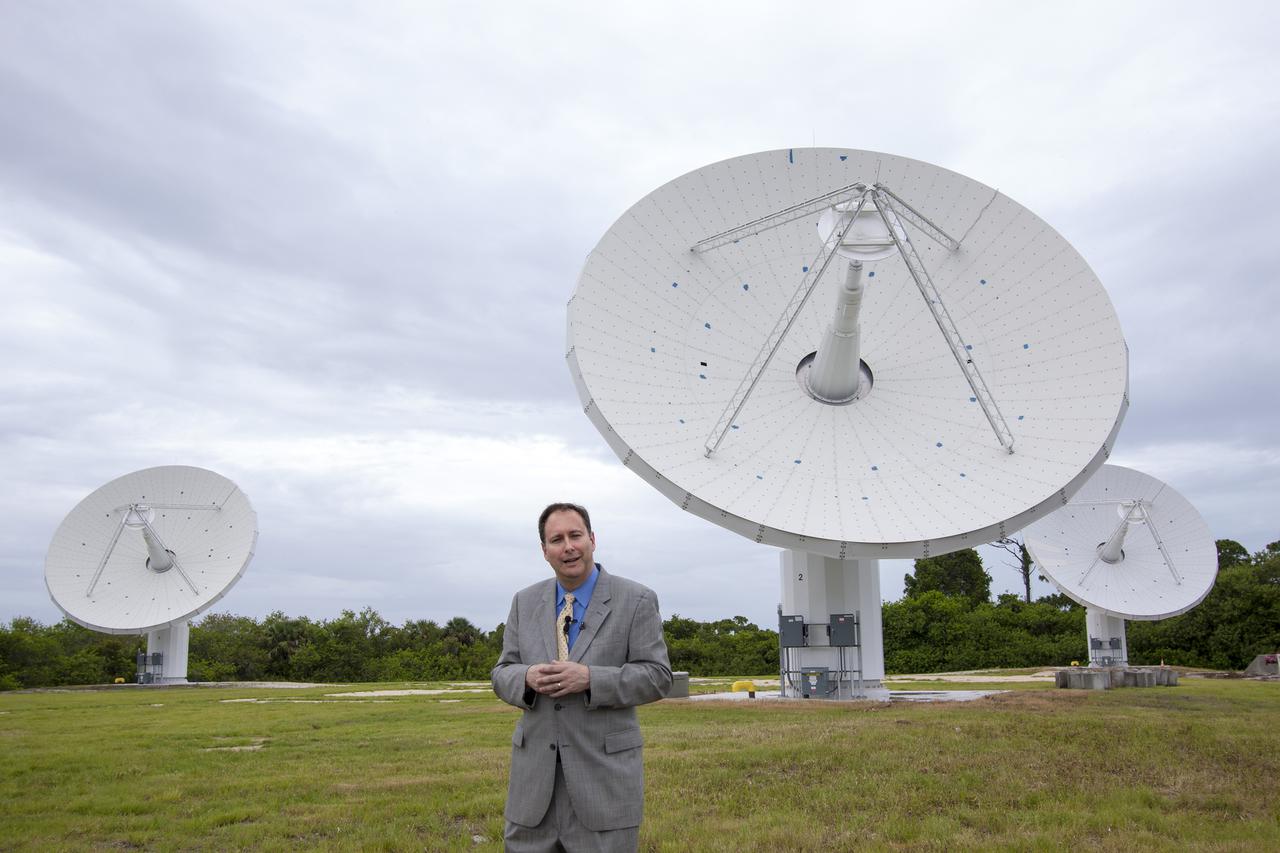 CAPE CANAVERAL, Fla. – At NASA’s Kennedy Space Center in Florida, Robert Lightfoot, NASA associate director, talks to members of the media at the Ka Band Objects Observation and Monitoring, or KaBOOM, testbed antenna array site during a tour of Kennedy facilities.  The goal of KaBOOM is to prove technologies that will allow future systems to characterize near-Earth objects in terms of size, shape, rotation_tumble rate and to determine the trajectory of those objects. Radar studies can determine the trajectory 100,000 times more precisely than can optical methods. While also capable of space communication and radio science experiments, developing radar applications is the primary focus of the arrays. The 40-foot-diameter dish antenna arrays are at the site of the former Vertical Processing Facility, which has been demolished. Photo credit: NASA_Jim Grossmann