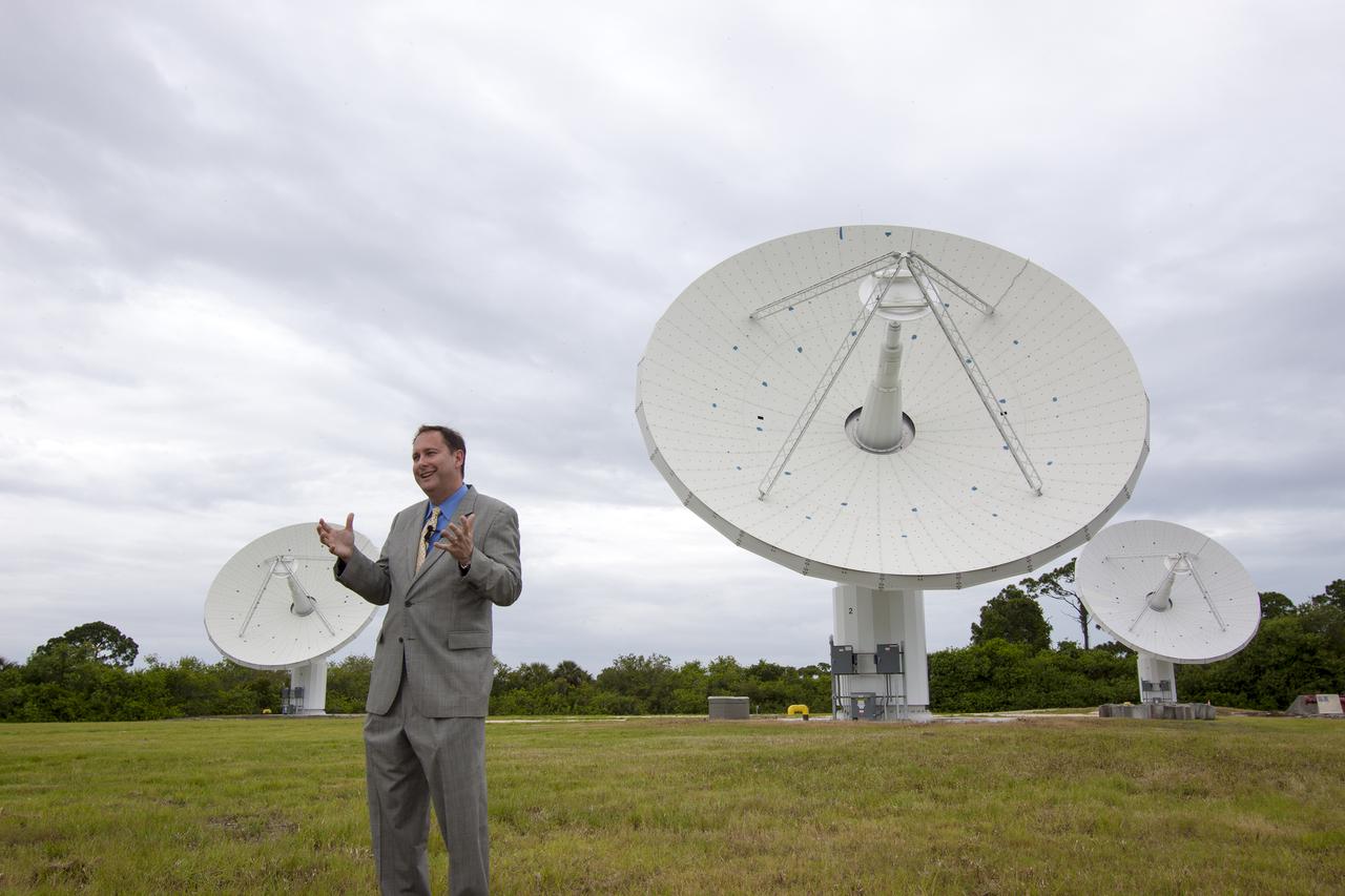 CAPE CANAVERAL, Fla. – At NASA’s Kennedy Space Center in Florida, Robert Lightfoot, NASA associate director, talks to members of the media at the Ka Band Objects Observation and Monitoring, or KaBOOM, testbed antenna array site during a tour of Kennedy facilities.  The goal of KaBOOM is to prove technologies that will allow future systems to characterize near-Earth objects in terms of size, shape, rotation_tumble rate and to determine the trajectory of those objects. Radar studies can determine the trajectory 100,000 times more precisely than can optical methods. While also capable of space communication and radio science experiments, developing radar applications is the primary focus of the arrays. The 40-foot-diameter dish antenna arrays are at the site of the former Vertical Processing Facility, which has been demolished. Photo credit: NASA_Jim Grossmann