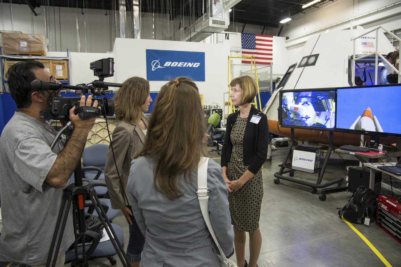 Crew Commercial Office's PAO activities for Boeing's rollout of their CST-100 capsule - "First Look" Media Event.  Photo Date: July 22, 2013.  Location: Boeing - Houston Product Support Center.  Photographer: Robert Markowitz