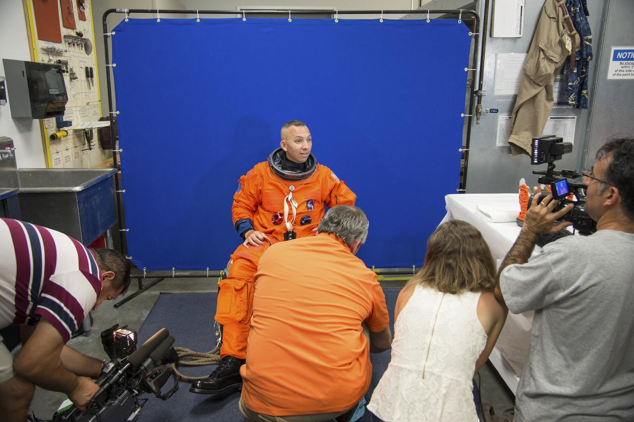 Crew Commercial Office's PAO activities for Boeing's rollout of their CST-100 capsule - "First Look" Media Event.  Photo Date: July 22, 2013.  Location: Boeing - Houston Product Support Center.  Photographer: Robert Markowitz