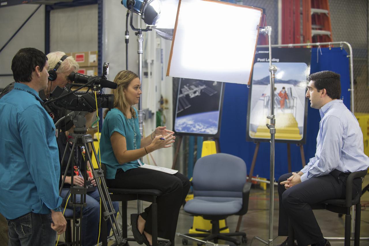 Crew Commercial Office's PAO activities for Boeing's rollout of their CST-100 capsule - "First Look" Media Event.  Photo Date: July 23, 2013.  Location: Boeing - Houston Product Support Center.  Photographer: Robert Markowitz