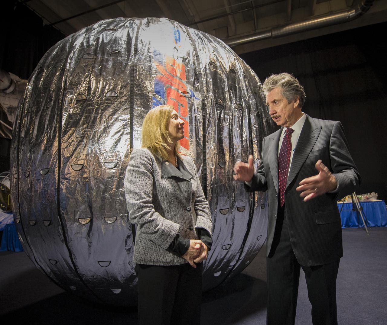NASA Deputy Administrator Lori Garver and President and founder of Bigelow Aerospace Robert T. Bigelow talk while standing next to the Bigelow Expandable Activity Module (BEAM) during a media briefing where is was announced that the BEAM expandable space habitat technology will be tested on the International Space Station, Wednesday, Jan. 16, 2013 in Las Vegas. BEAM is scheduled to arrive at the space station in 2015 for a two-year technology demonstration. Photo Credit: (NASA/Bill Ingalls)