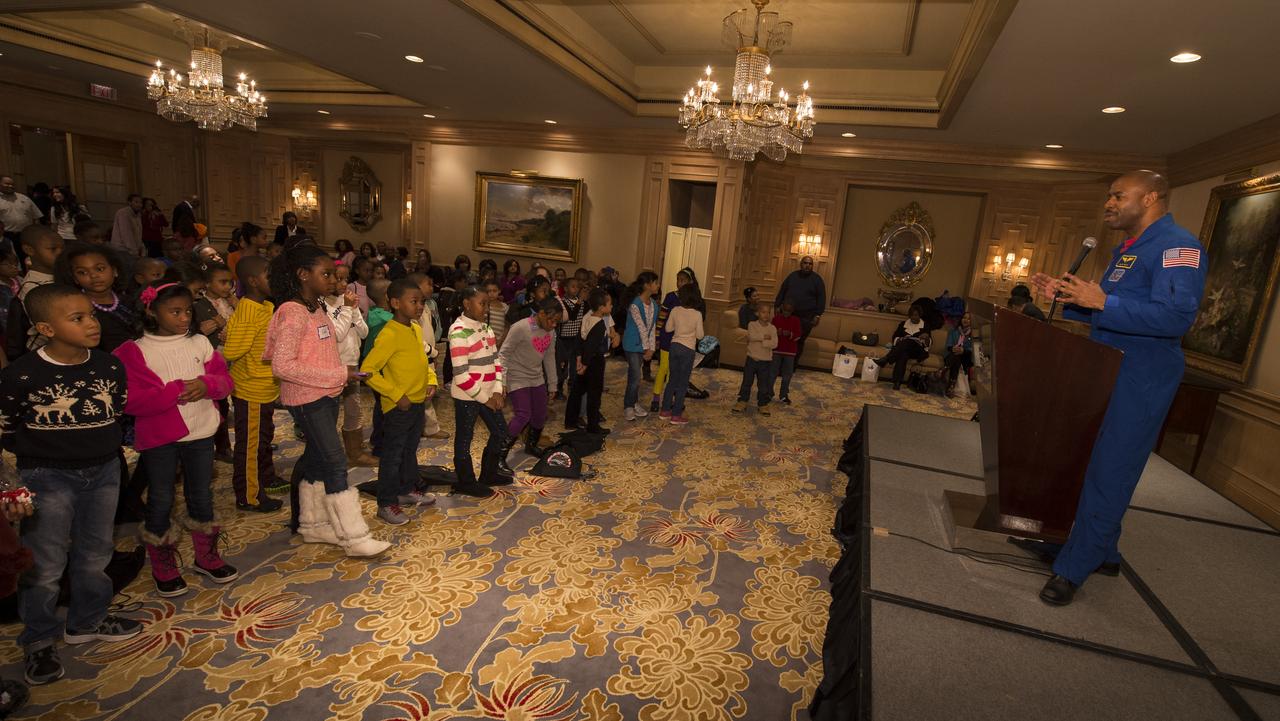 NASA Astronaut and Associate Administrator for Education, Leland Melvin, talks to school children during an Science, Technology, Engineering, and Math (STEM) education event held at the Ritz-Carlton Hotel in Arlington, VA on Saturday, Jan. 19, 2013.  Students were able to meet with Astronaut Melvin, conduct experiments, build their own space jab, and touch a mockup space suit.  Photo Credit: (NASA/Bill Ingalls)