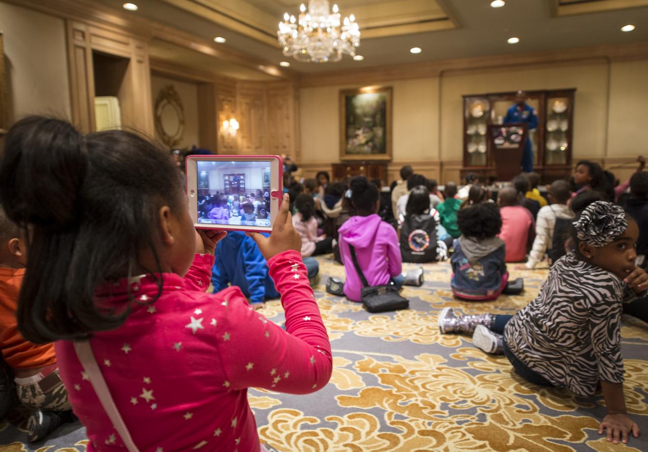 NASA Astronaut and Associate Administrator for Education, Leland Melvin, talks to school children during an Science, Technology, Engineering, and Math (STEM) education event held at the Ritz-Carlton Hotel in Arlington, VA on Saturday, Jan. 19, 2013.  Students were able to meet with Astronaut Melvin, conduct experiments, build their own space jab, and touch a mockup space suit.  Photo Credit: (NASA/Bill Ingalls)