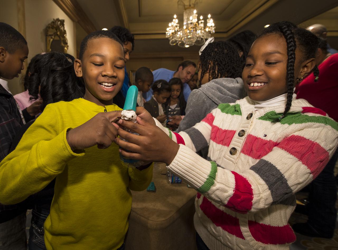 School children are taught to build their own spacecraft and habitat during a Science, Technology, Engineering, and Math (STEM) education event held at the Ritz-Carlton Hotel in Arlington, VA on Saturday, Jan. 19, 2013.  Students were able to meet with Astronaut Leland Melvin, conduct experiments, build their own space jab, and touch a mockup space suit.  Photo Credit: (NASA/Bill Ingalls)