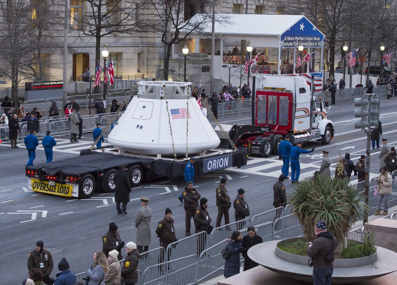 The Orion space capsule is seen as it rolls down Pennsylvania Avenue during the inaugural parade honoring President Barack Obaama, Monday Jan. 21, 2013, in Washington. Obama was sworn-in as the nation's 44th President earlier in the day. Photo Credit: (NASA/Carla Cioffi)