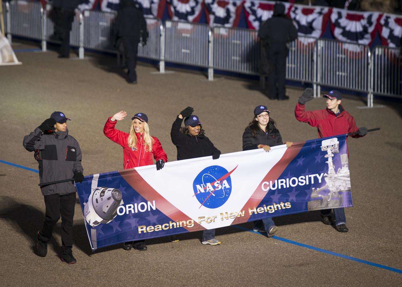 NASA employees, led by flag-bearer Marquell D. Proctor from Bishop Macnamara High School, march along Pennsylvania Avenue during the inaugural parade honoring President Barack Obama, Monday, Jan. 21. 2013, in Washington. Obama was sworn-in as the nation's 44th President earlier in the day. Photo Credit: (NASA/Bill Ingalls)