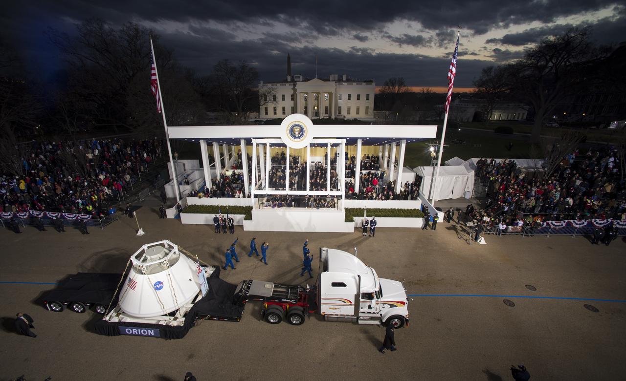 The Orion space capsule along with NASA Astronauts Lee Morin, Alvin Drew, Kjell Lindgren, Serena Aunon, Kate Rubins, and Mike Massimino pass the Presidential viewing stand and President Barack Obama during the inaugural parade honoring Obama, Monday Jan. 21, 2013, in Washington. Obama was sworn-in as the nation's 44th President earlier in the day. Photo Credit: (NASA/Bill Ingalls)