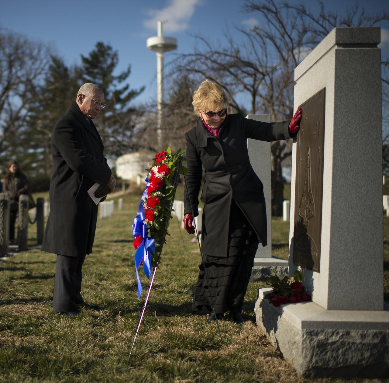 June Scobee Rodgers, widow of Challenger Space Shuttle Commander Dick Scobee and NASA Administrator Charles Bolden, along with others from NASA, visit the Space Shuttle Columbia Memorial during a wreath laying ceremony that was part of NASA's Day of Remembrance, Friday, Feb. 1, 2013, at Arlington National Cemetery.  Wreathes were laid in memory of those men and women who lost their lives in the quest for space exploration.  Photo Credit: (NASA/Bill Ingalls)
