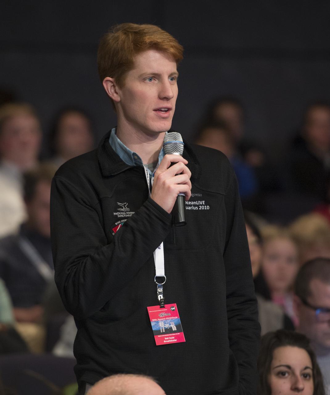 A NASA Social participant asks a question at a NASA Social exploring science on the ISS at NASA Headquarters, Wednesday, Feb. 20, 2013 in Washington. Photo Credit: (NASA/Carla Cioffi)