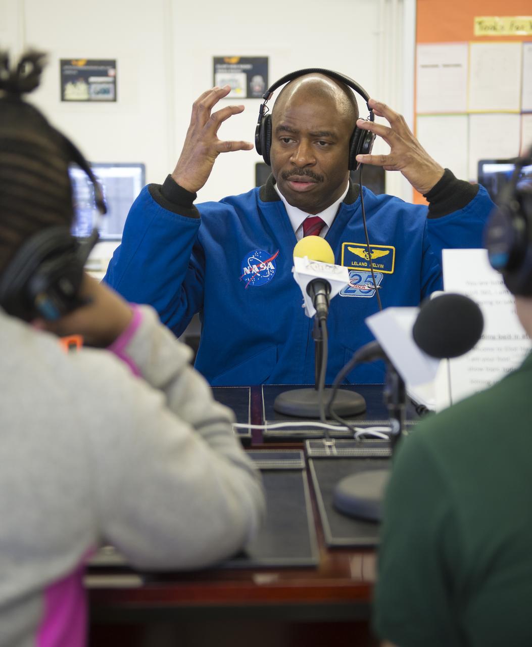 Leland Melvin, NASA Associate Administrator for Education and former astronaut, is interviewed by sixth grade students from the Broadcast Media Class at Eliot Hine Middle School on Friday, March 1, 2013 in Washington.  The radio club program, Eliot Hine Radio, is broadcast live on the internet.  Photo Credit: (NASA/Carla Cioffi)