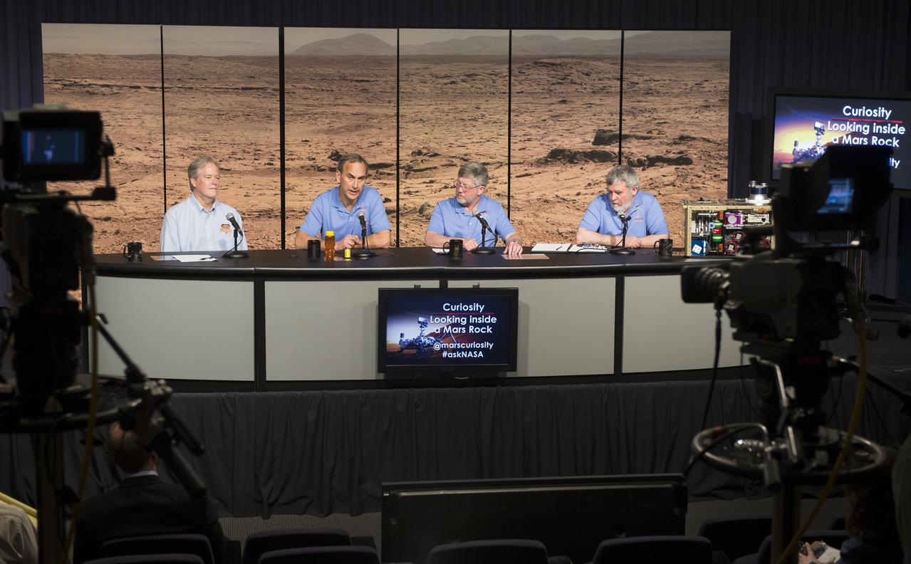 Participants at a news conference discussing findings of the analysis of a rock sample from Mars are seen, Tuesday, March 12, 2013 at NASA Headquarters in Washington.  From left to right are seen: Michael Meyer, lead scientist, Mars Exploration Program at NASA Headquarters; John Grotzinger, Curiosity project scientist, California Institute of Technology in Pasadena; David Blake, principal investigator for Curiosity's Chemistry and Mineralogy investigation at NASA's Ames Research Center in Calif.; and Paul Mahaffy, principal investigator for Curiosity's Sample Analysis at Mars (SAM) investigation at NASA's Goddard Space Flight Center in Maryland.  Photo Credit:  (NASA/Carla Cioffi)