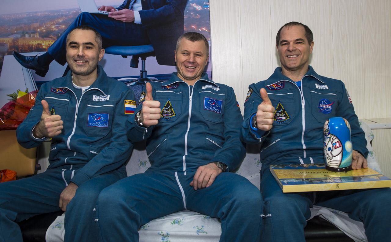 Expedition 34 Russian Flight Engineer Evgeny Tarelkin, left, Russian Soyuz Commander Oleg Novitskiy, center, and Commander Kevin Ford of NASA sit together at the Kustanay Airport a few hours after they landed near the town of Arkalyk, Kazakhstan on Saturday, March 16, 2013. Ford, Novitskiy, and Tarelkin are returning from 142 days onboard the International Space Station where they served as members of the Expedition 33 and 34 crews. Photo Credit: (NASA/Bill Ingalls)