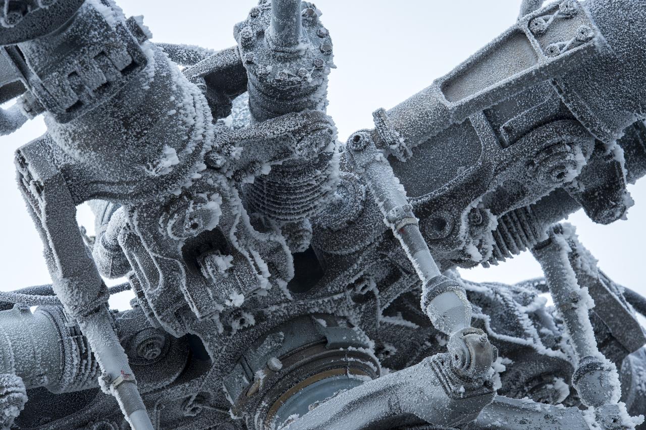 A heavily frosted rotor of a Search and Rescue helicopter is seen as it is grounded by low visibility at the Arkalyk Airport in Kazakhstan on Saturday, March 16, 2013. The Soyuz TMA-06M spacecraft landed with Expedition 34 Commander Kevin Ford of NASA, Russian Soyuz Commander Oleg Novitskiy and Russian Flight Engineer Evgeny Tarelkin near the town of Arkalyk, Kazakhstan on Saturday, March 16, 2013. Ford, Novitskiy, and Tarelkin returned from 142 days onboard the International Space Station where they served as members of the Expedition 33 and 34 crews. Photo Credit: (NASA/Bill Ingalls)