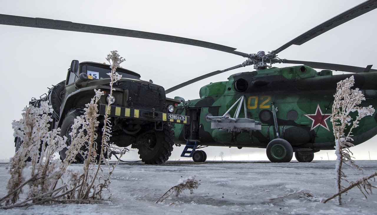 A Search and Rescue helicopter is seen grounded by low visibility at the Arkalyk Airport in Kazakhstan on Saturday, March 16, 2013. The Soyuz TMA-06M spacecraft landed with Expedition 34 Commander Kevin Ford of NASA, Russian Soyuz Commander Oleg Novitskiy and Russian Flight Engineer Evgeny Tarelkin near the town of Arkalyk, Kazakhstan on Saturday, March 16, 2013. Ford, Novitskiy, and Tarelkin returned from 142 days onboard the International Space Station where they served as members of the Expedition 33 and 34 crews. Photo Credit: (NASA/Bill Ingalls)