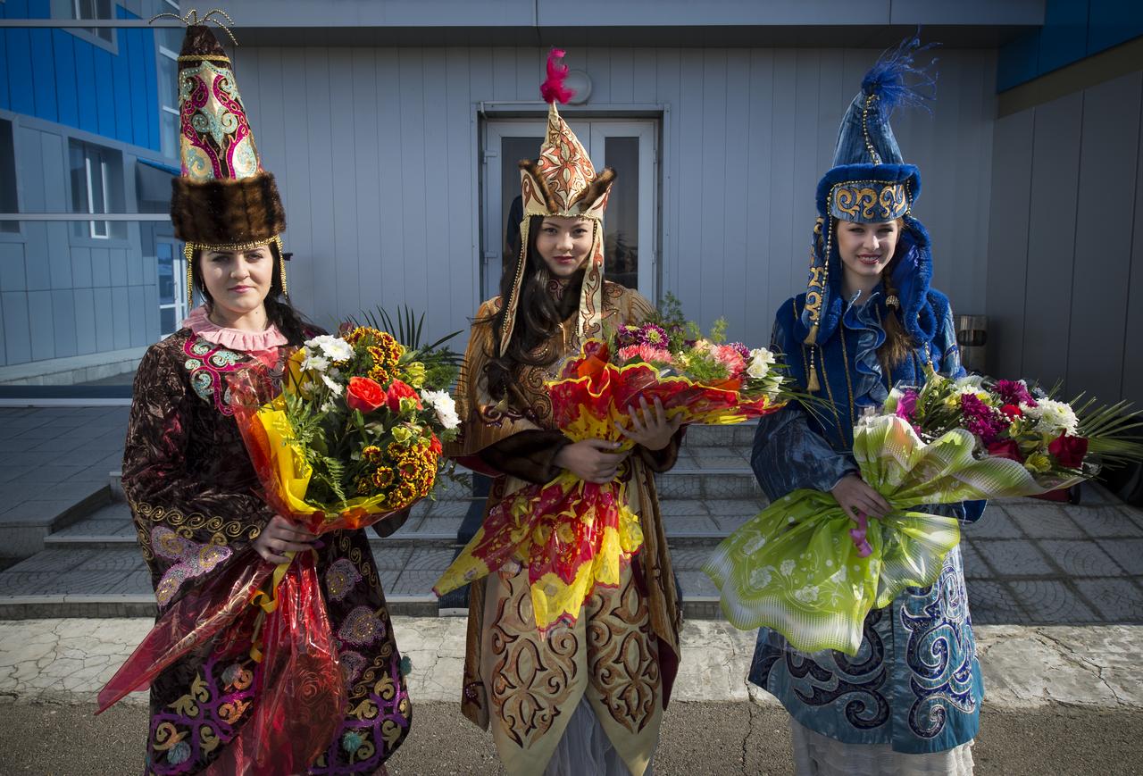 Women in ceremonial Kazakh dress prepare to welcome home Expedition 34 Russian Flight Engineer Evgeny Tarelkin, Commander Kevin Ford of NASA, and Russian Soyuz Commander Oleg Novitskiy at the Kustanay Airport a few hours after they landed near the town of Arkalyk, Kazakhstan on Saturday, March 16, 2013. Tarelkin, Ford, and Novitskiy, returned from 142 days onboard the International Space Station where they served as members of the Expedition 33 and 34 crews. Photo Credit: (NASA/Bill Ingalls)