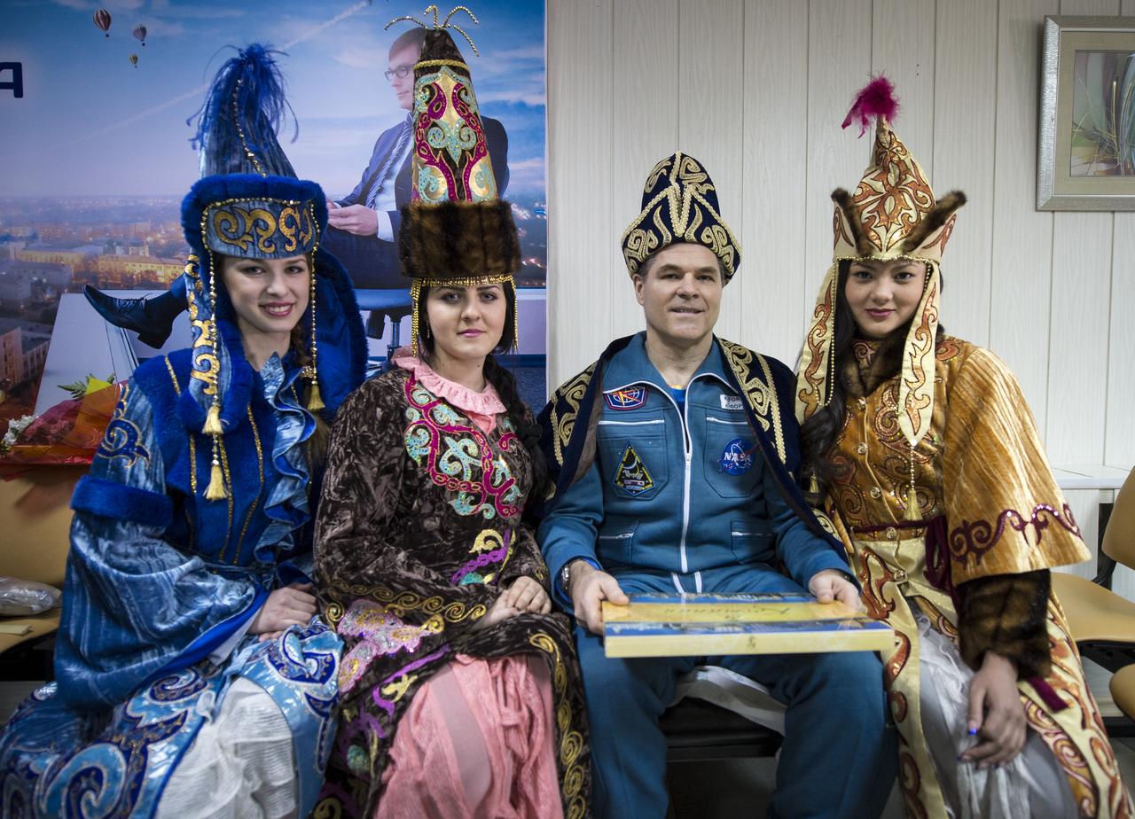Expedition 34 Commander Kevin Ford of NASA poses for a photograph with women in ceremonial Kazakh dress at the Kustanay Airport in Kazakhstan a few hours after he, along with Expedition 34 Russian Soyuz Commander Oleg Novitskiy, and Russian Flight Engineer Evgeny Tarelkin, landed their Soyuz TMA-06M spacecraft near the town of Arkalyk on Saturday, March 16, 2013. Ford, Novitskiy, and, Tarelkin returned from 142 days onboard the International Space Station where they served as members of the Expedition 33 and 34 crews. Photo Credit: (NASA/Bill Ingalls)