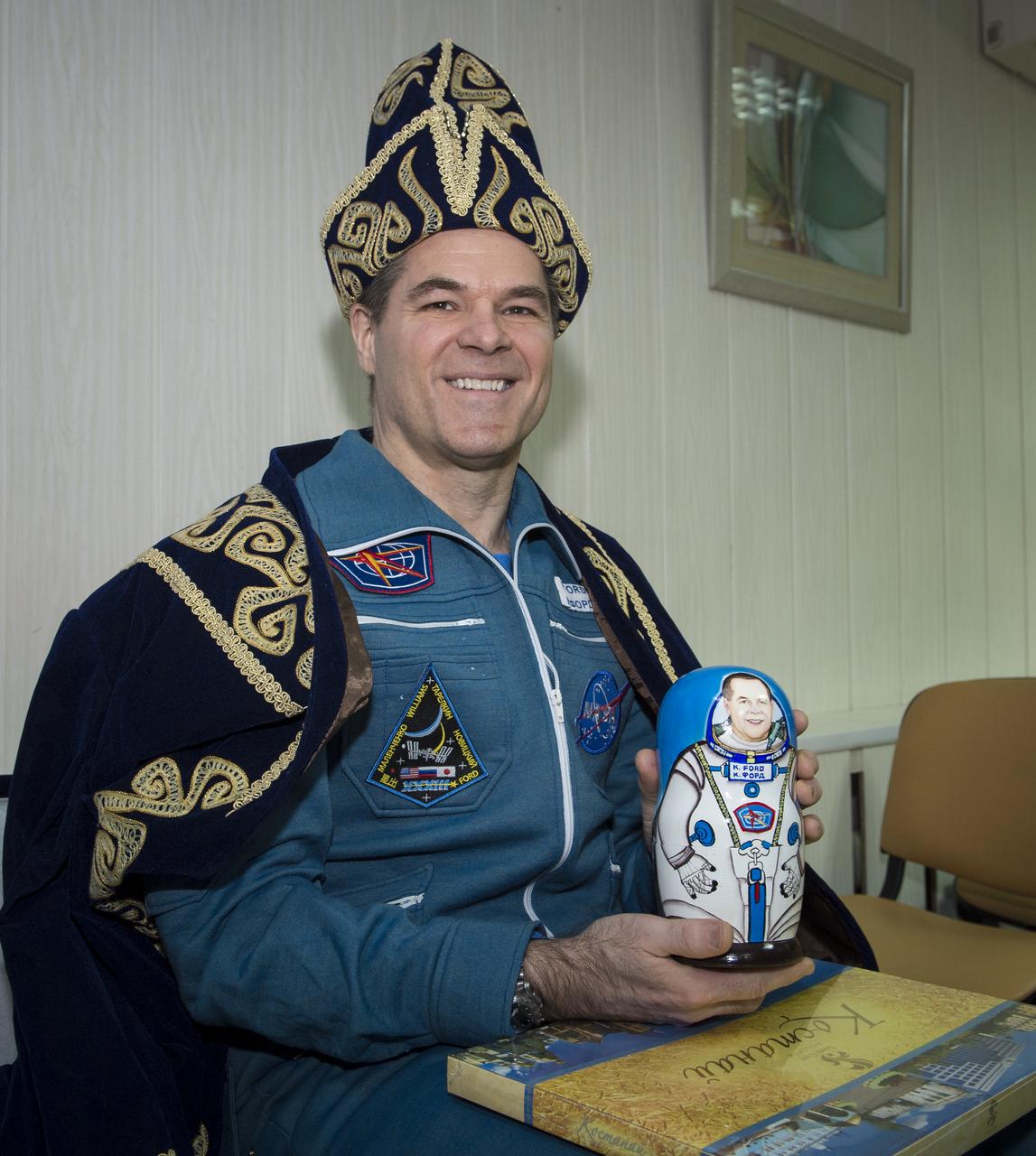 Expedition 34 Commander Kevin Ford of NASA poses for a photograph after receiving welcome home gifts at the Kustanay Airport in Kazakhstan a few hours after he, along with Expedition 34 Russian Soyuz Commander Oleg Novitskiy, and Russian Flight Engineer Evgeny Tarelkin, landed their Soyuz TMA-06M spacecraft near the town of Arkalyk on Saturday, March 16, 2013. Ford, Novitskiy, and, Tarelkin returned from 142 days onboard the International Space Station where they served as members of the Expedition 33 and 34 crews. Photo Credit: (NASA/Bill Ingalls)