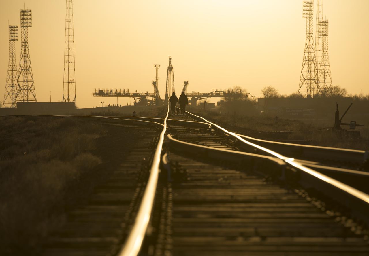 Russia security forces and their dog walk along the train track to the Soyuz launch pad, Tuesday, March 26, 2013 at the Baikonur Cosmodrome in Kazakhstan. Launch of the Soyuz rocket is scheduled for March 29 and will send Expedition 35 Soyuz Commander Pavel Vinogradov, and Flight Engineers Chris Cassidy of NASA and Alexander Misurkin of Russia on a five and a half-month mission aboard the International Space Station. Photo Credit: (NASA/Carla Cioffi)
