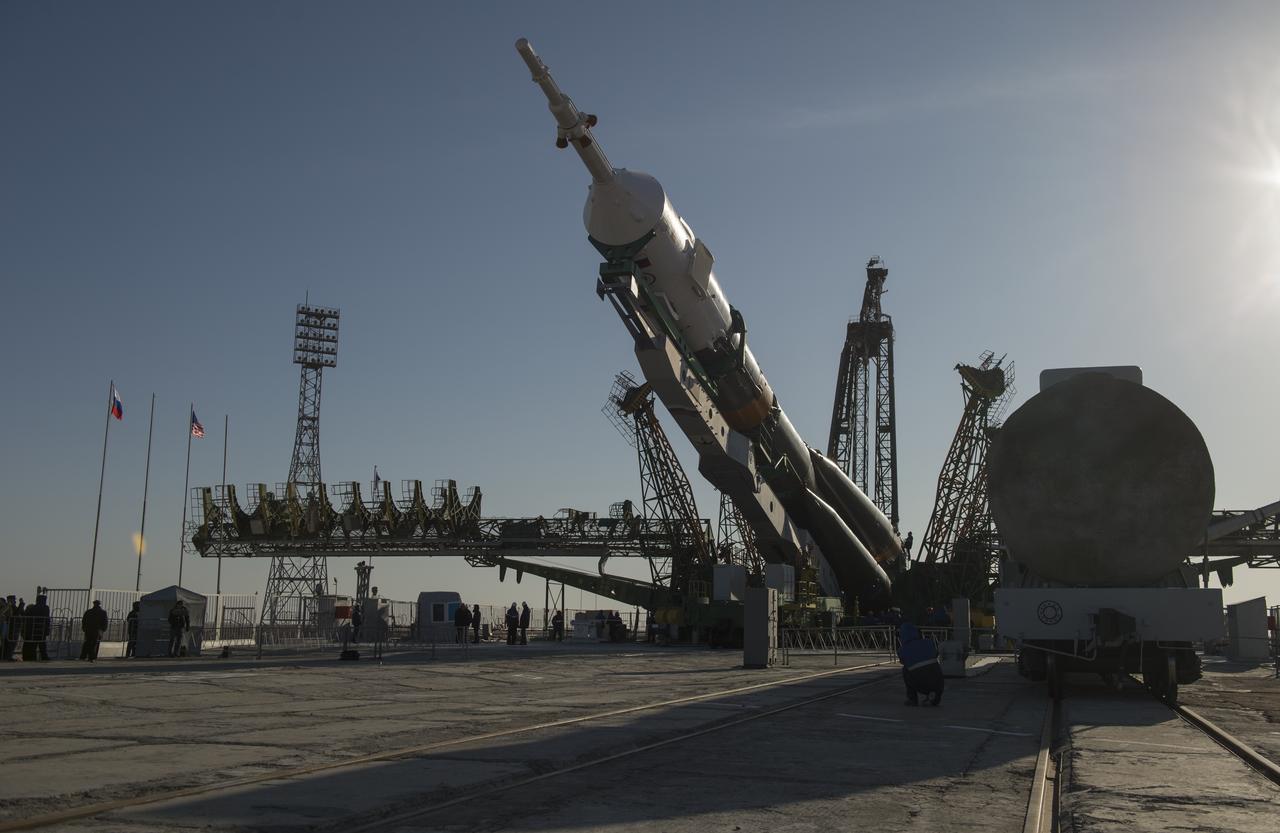 The Soyuz rocket is erected into position after being rolled out to the launch pad by train on Tuesday, March 26, 2013, at the Baikonur Cosmodrome in Kazakhstan. Launch of the Soyuz rocket is scheduled for March 29 and will send Expedition 35 Soyuz Commander Pavel Vinogradov, and Flight Engineers Chris Cassidy of NASA and Alexander Misurkin of Russia on a five and a half-month mission aboard the International Space Station. Photo Credit: (NASA/Carla Cioffi)