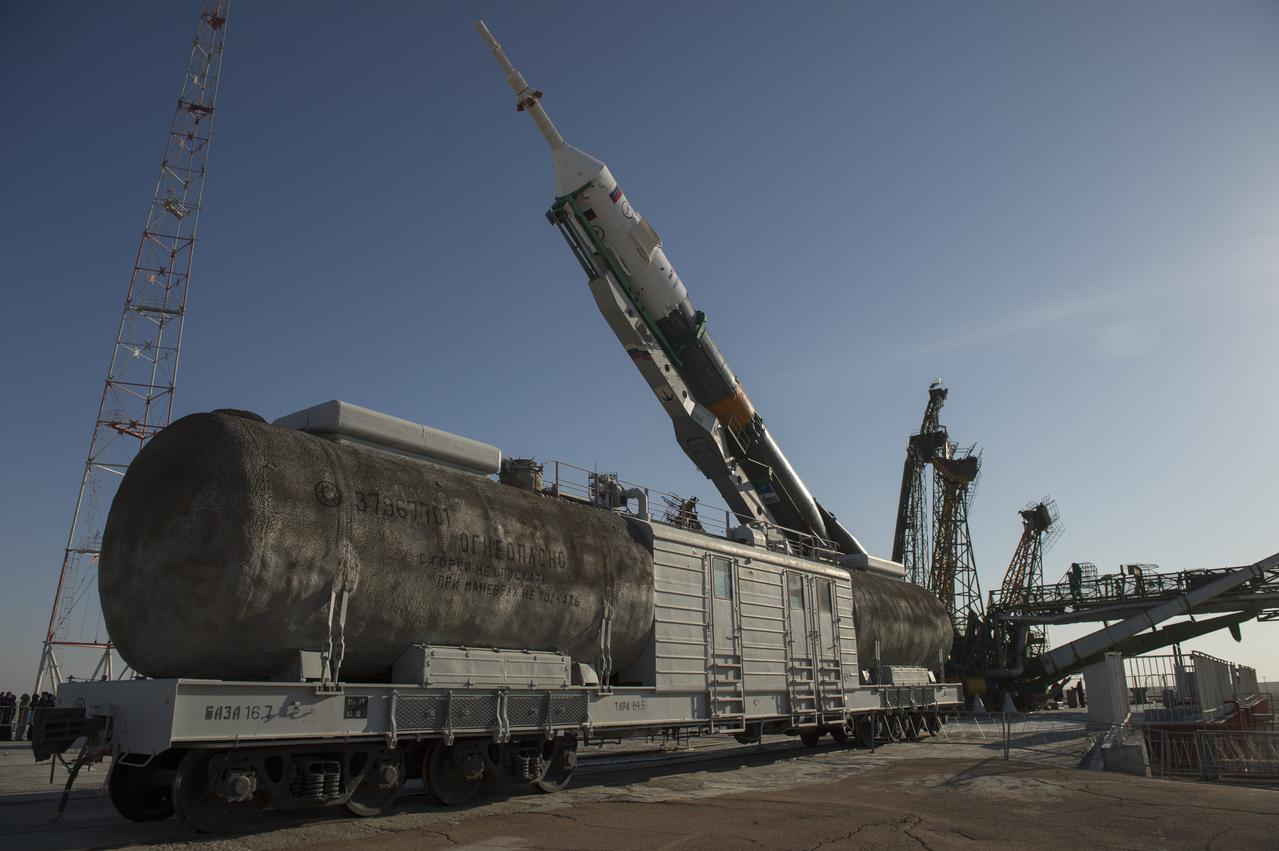 The Soyuz rocket is erected into position after being rolled out to the launch pad by train on Tuesday, March 26, 2013, at the Baikonur Cosmodrome in Kazakhstan. Launch of the Soyuz rocket is scheduled for March 29 and will send Expedition 35 Soyuz Commander Pavel Vinogradov, and Flight Engineers Chris Cassidy of NASA and Alexander Misurkin of Russia on a five and a half-month mission aboard the International Space Station. Photo Credit: (NASA/Carla Cioffi)