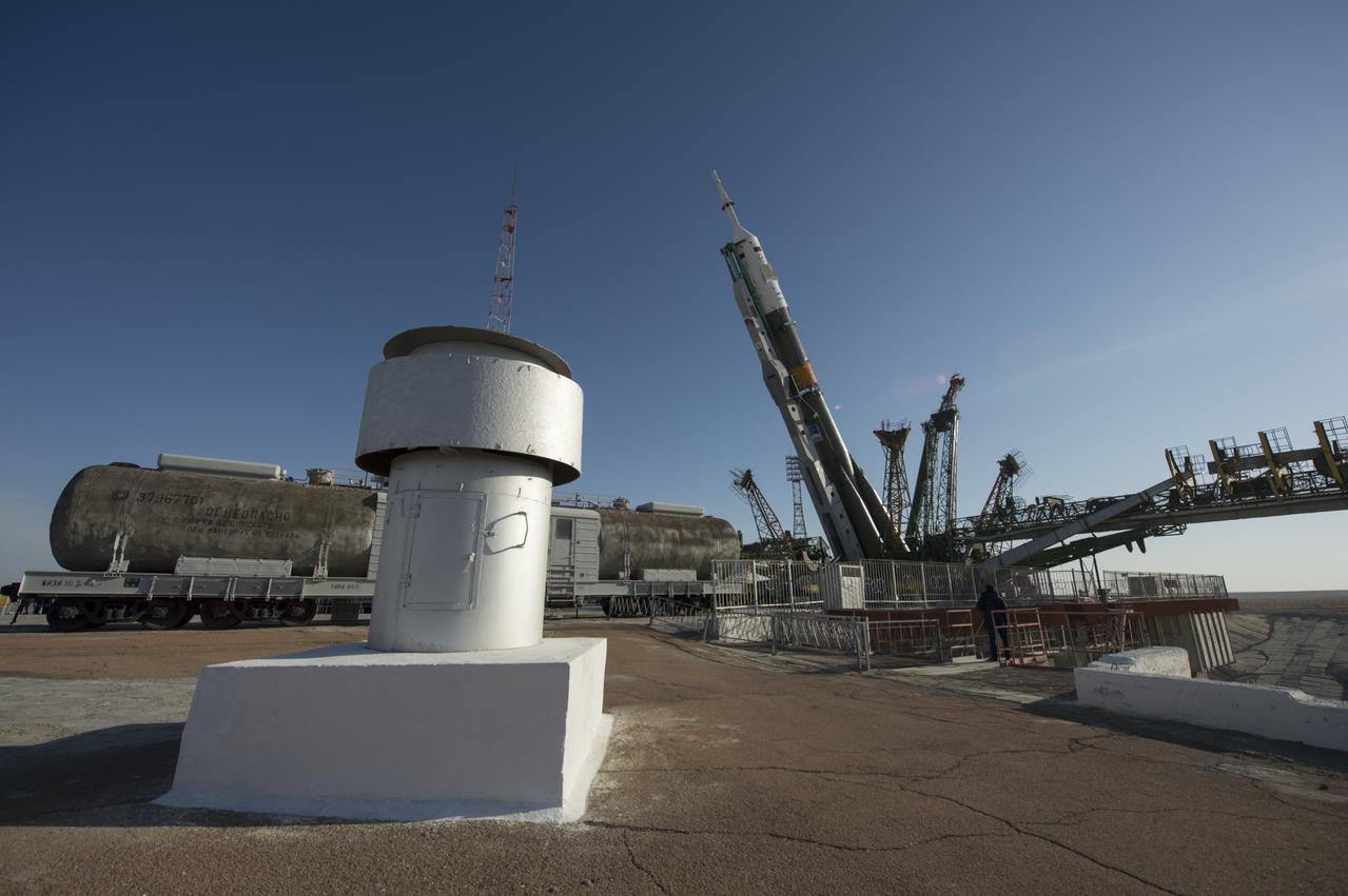 The Soyuz rocket is erected into position after being rolled out to the launch pad by train on Tuesday, March 26, 2013, at the Baikonur Cosmodrome in Kazakhstan. Launch of the Soyuz rocket is scheduled for March 29 and will send Expedition 35 Soyuz Commander Pavel Vinogradov, and Flight Engineers Chris Cassidy of NASA and Alexander Misurkin of Russia on a five and a half-month mission aboard the International Space Station. Photo Credit: (NASA/Carla Cioffi)