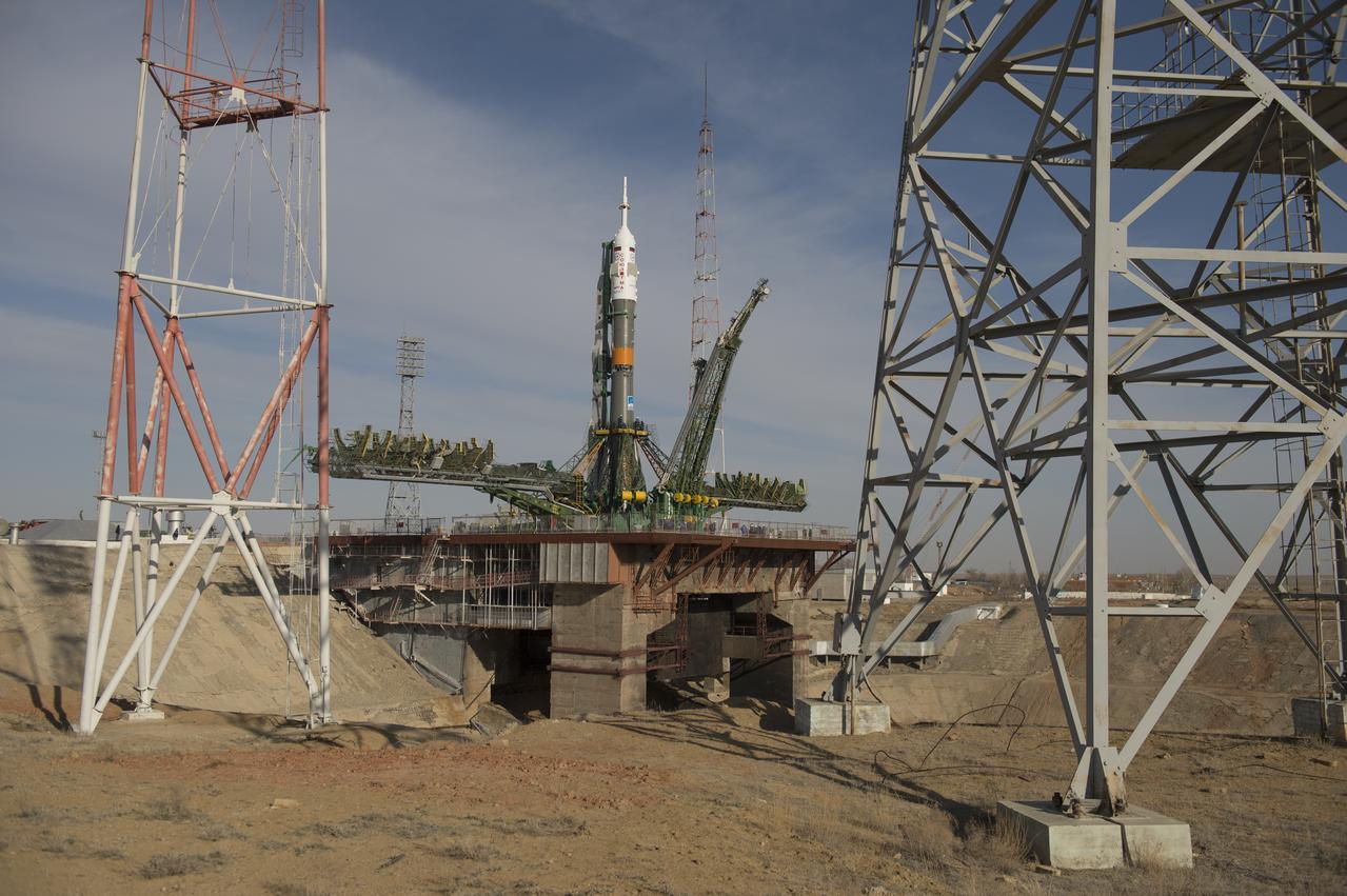 The Soyuz rocket is seen on its launch pad shortly after being lifted into its upright position on Tuesday March 26, 2013, at the Baikonur Cosmodrome in Kazakhstan. Launch of the Soyuz rocket is scheduled for March 29 and will send Expedition 35 Soyuz Commander Pavel Vinogradov, and Flight Engineers Chris Cassidy of NASA and Alexander Misurkin of Russia on a five and a half-month mission aboard the International Space Station. Photo Credit: (NASA/Carla Cioffi)