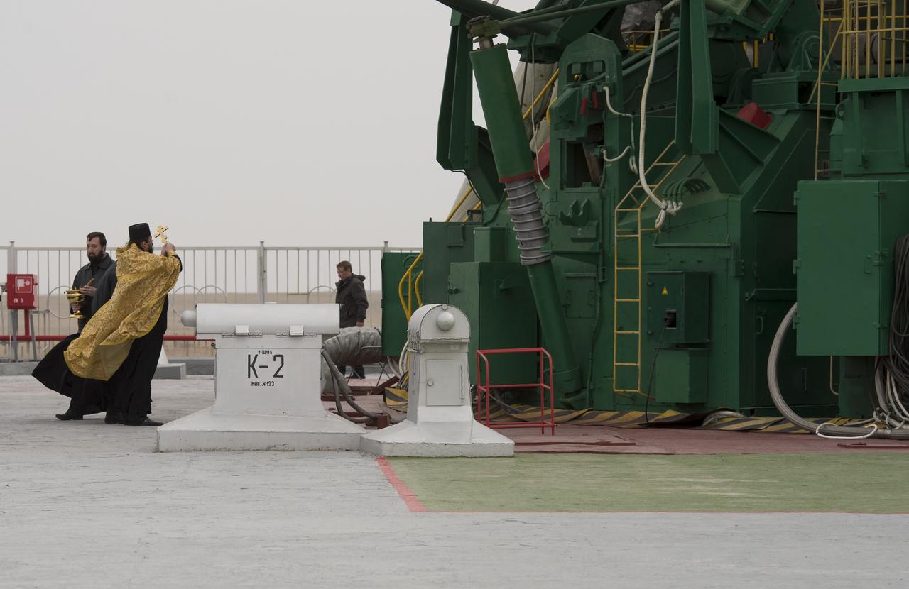 An Orthodox priest blesses the Soyuz rocket at the Baikonur Cosmodrome launch pad on Wednesday, March 27, 2013 in Kazakhstan. Launch of the Soyuz rocket is scheduled for March 29 and will send Expedition 35 Soyuz Commander Pavel Vinogradov, and Flight Engineers Chris Cassidy of NASA and Alexander Misurkin of Russia on a five and a half-month mission aboard the International Space Station. Photo Credit: (NASA/Carla Cioffi)