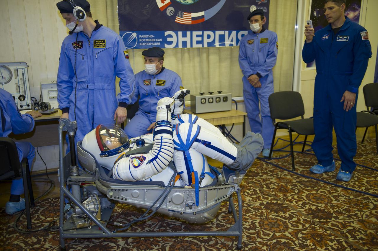 Expedition 35 NASA Flight Engineer Chris Cassidy has his Russian Sokol suit pressure checked ahead of his launch onboard a Soyuz TMA-08M spacecraft to the International Space Station, Thursday, March 28, 2013, at the Baikonur Cosmodrome in Kazakhstan. Launch of the Soyuz rocket will send Cassidy, Soyuz Commander Pavel Vinogradov and Russian Flight Engineer Alexander Misurkin on a five and a half-month mission aboard the International Space Station. Photo Credit: (NASA/GCTC/Irina Peshkova)