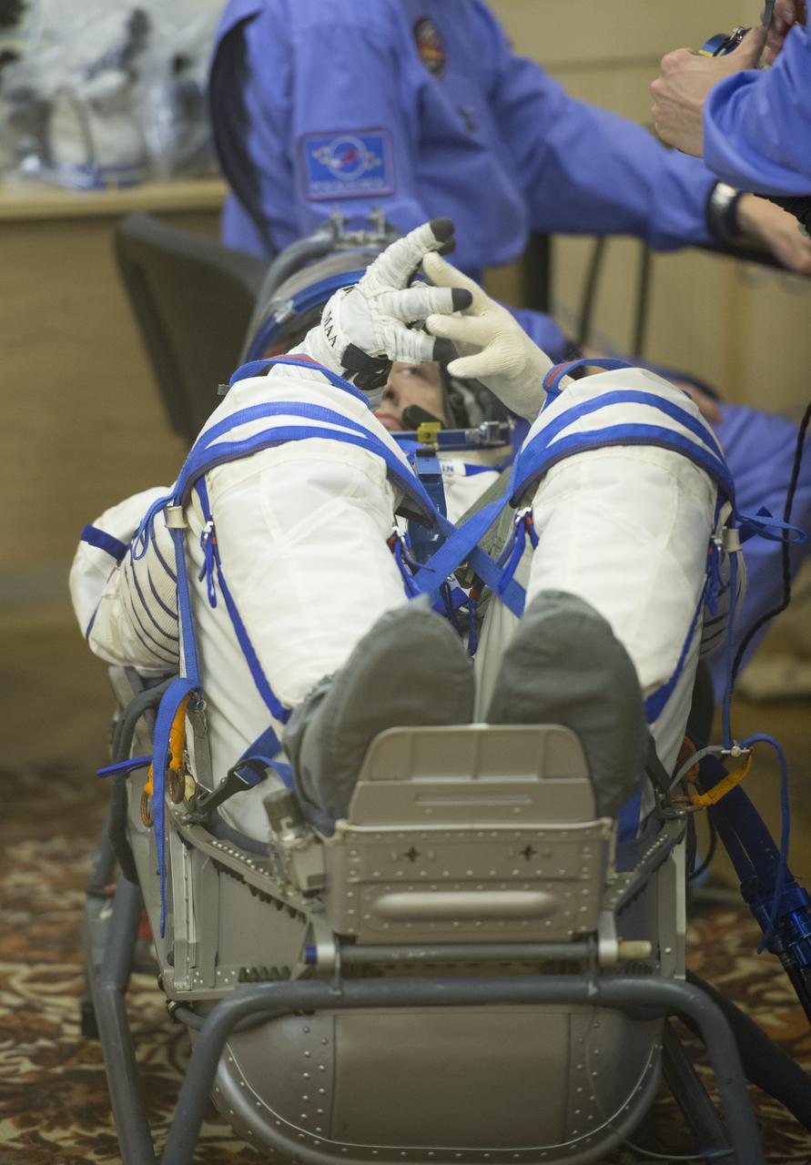 Expedition 35 Russian Flight Engineer Alexander Misurkin has his Russian Sokol suit pressure checked ahead of his launch onboard a Soyuz TMA-08M spacecraft to the International Space Station, Thursday, March 28, 2013, at the Baikonur Cosmodrome in Kazakhstan. Launch of the Soyuz rocket will send Misurkin, Soyuz Commander Pavel Vinogradov and NASA Flight Engineer Chris Cassidy on a five and a half-month mission aboard the International Space Station. Photo Credit: (NASA/Carla Cioffi)