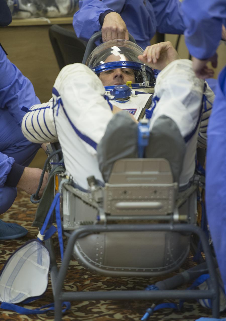 Expedition 35 NASA Flight Engineer Chris Cassidy has his Russian Sokol suit pressure checked ahead of his launch onboard a Soyuz TMA-08M spacecraft to the International Space Station, Thursday, March 28, 2013, at the Baikonur Cosmodrome in Kazakhstan. Launch of the Soyuz rocket will send Cassidy, Soyuz Commander Pavel Vinogradov and Russian Flight Engineer Alexander Misurkin on a five and a half-month mission aboard the International Space Station. Photo Credit: (NASA/Carla Cioffi)