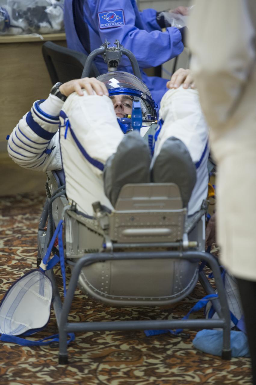 Expedition 35 NASA Flight Engineer Chris Cassidy has his Russian Sokol suit pressure checked ahead of his launch onboard a Soyuz TMA-08M spacecraft to the International Space Station, Thursday, March 28, 2013, at the Baikonur Cosmodrome in Kazakhstan. Launch of the Soyuz rocket will send Cassidy, Soyuz Commander Pavel Vinogradov and Russian Flight Engineer Alexander Misurkin on a five and a half-month mission aboard the International Space Station. Photo Credit: (NASA/Carla Cioffi)