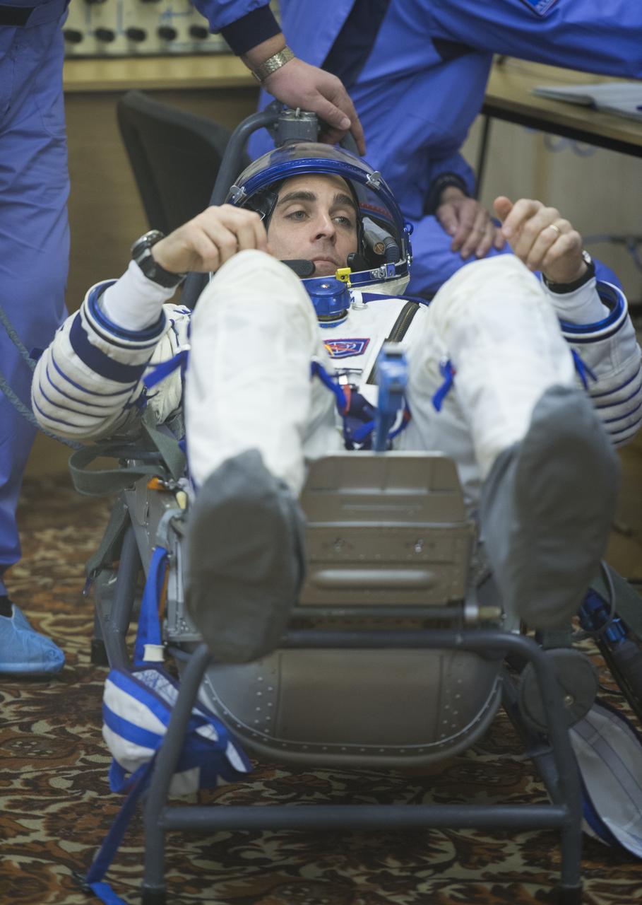 Expedition 35 NASA Flight Engineer Chris Cassidy has his Russian Sokol suit pressure checked ahead of his launch onboard a Soyuz TMA-08M spacecraft to the International Space Station, Thursday, March 28, 2013, at the Baikonur Cosmodrome in Kazakhstan. Launch of the Soyuz rocket will send Cassidy, Soyuz Commander Pavel Vinogradov and Russian Flight Engineer Alexander Misurkin on a five and a half-month mission aboard the International Space Station. Photo Credit: (NASA/Carla Cioffi)